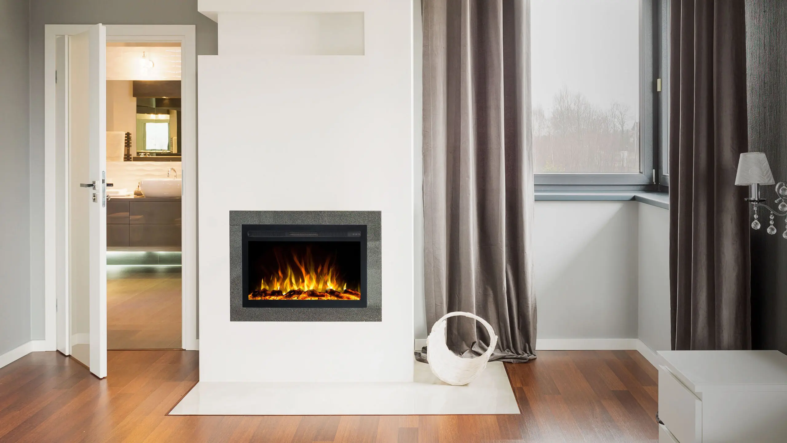 Elektrische inbouwhaard Infinity van Emotion Flame in een moderne wandopstelling met een realistisch oranje vlameffect en houtblokken.